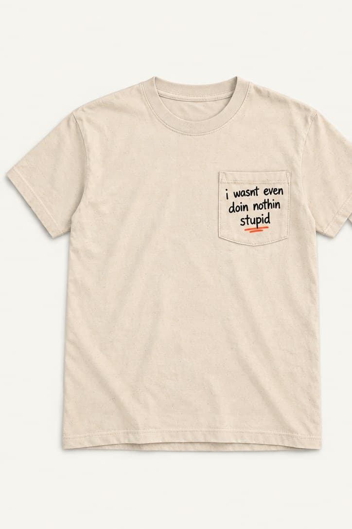 Vintage Cream pocket tee, front, with “i wasnt even doin nothin stupid” printed on the pocket